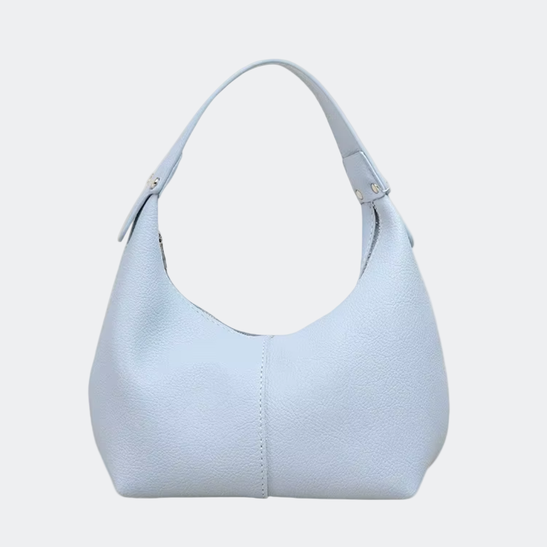Light blue handbag on a white background