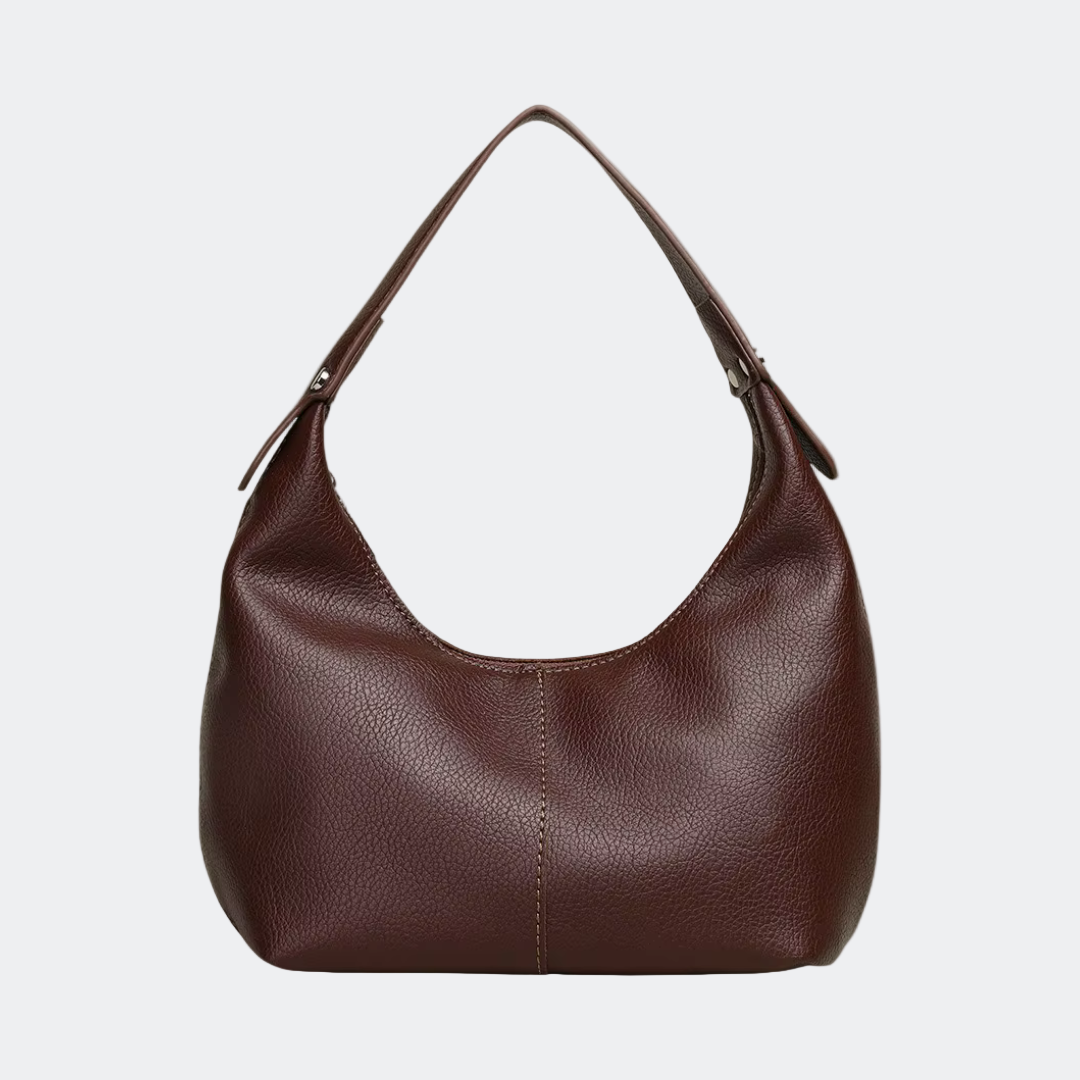 Brown leather handbag on a white background