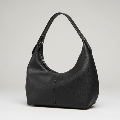 Black leather handbag on a white background