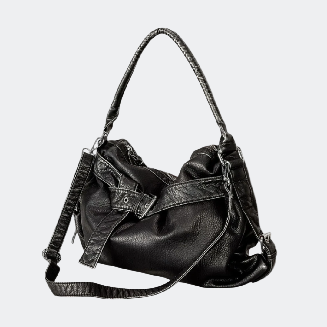 Black leather handbag with a shoulder strap on a white background