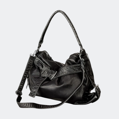 Black leather handbag with a shoulder strap on a white background