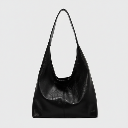 Black leather handbag on a white background